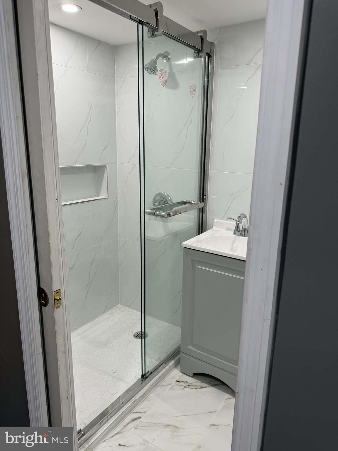 1344 Greeby Street Philadelphia, PA 19111 - Photo 15 of 19 a bathroom with a shower and a sink