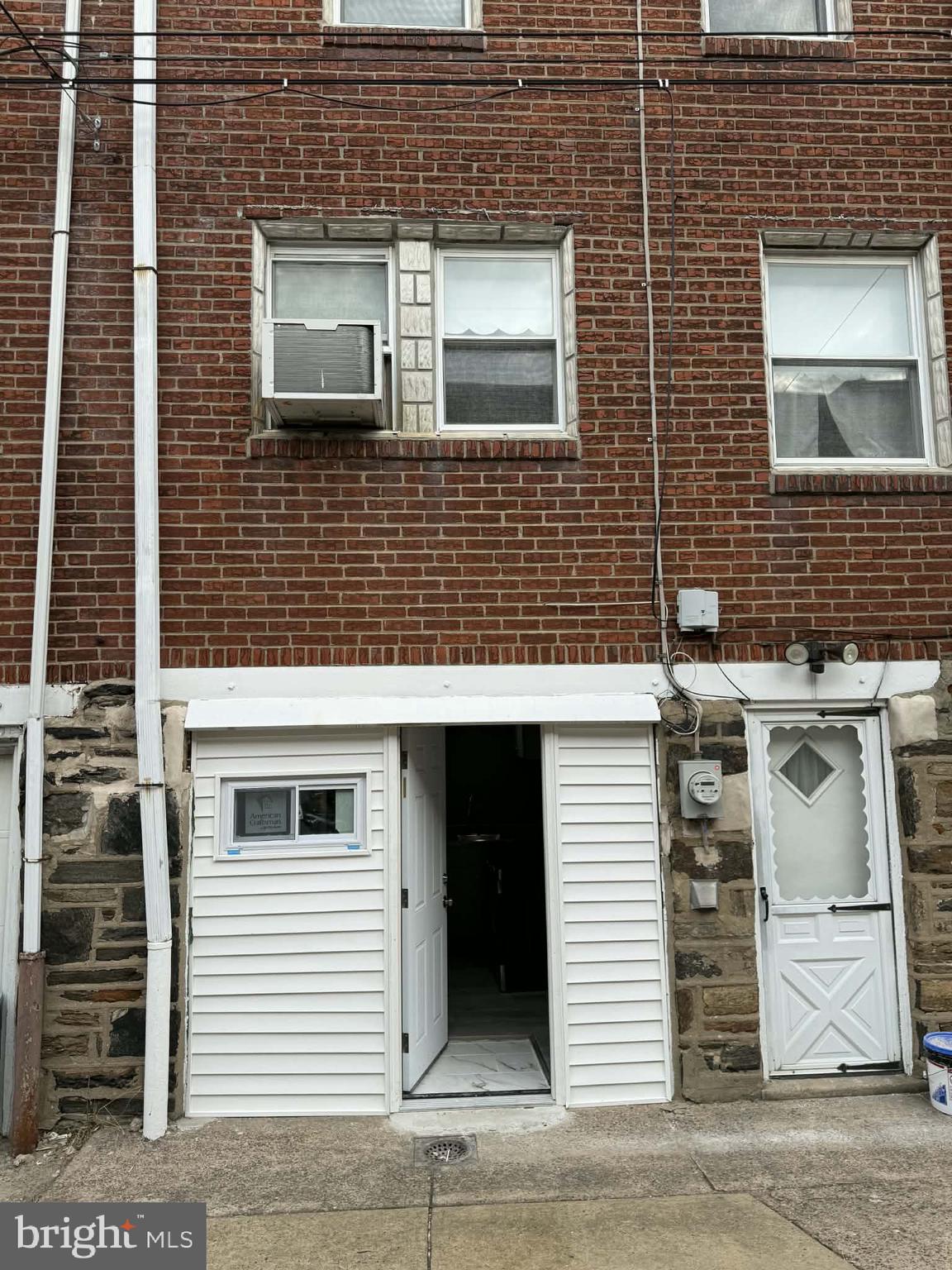 1344 Greeby Street Philadelphia, PA 19111 - Photo 19 of 19 a view of a brick house with white wall and door