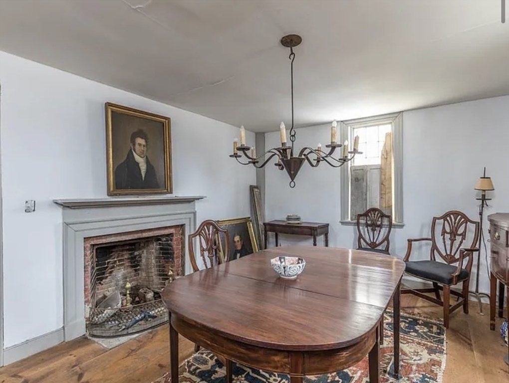 804 Main Street Ashby, MA 01431 - Photo 3 of 10 a view of a livingroom and dining room with furniture wooden floor a chandelier