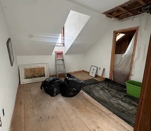 a bed room with furniture and a fireplace