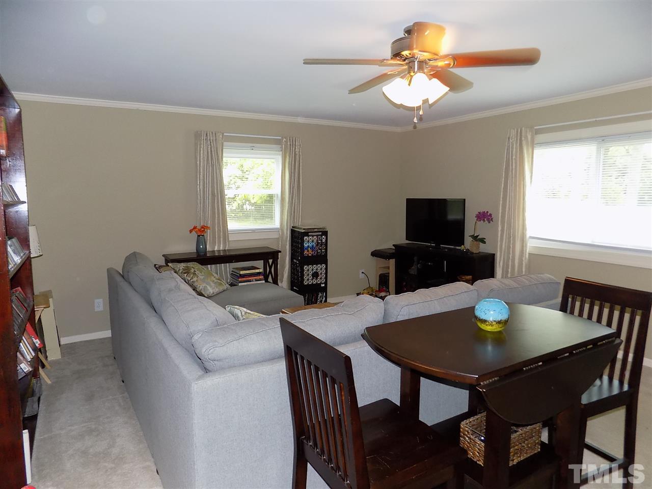 1319 Kelly Road Garner, NC 27529 - Photo 14 of 25 a view of a dining room with furniture