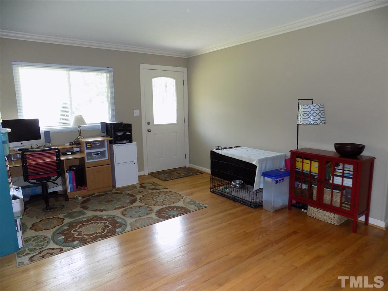 1319 Kelly Road Garner, NC 27529 - Photo 3 of 25 a view of a workspace with furniture and a window