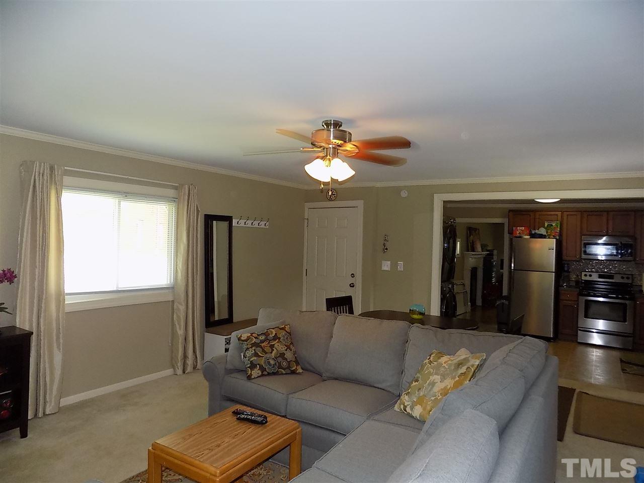 1319 Kelly Road Garner, NC 27529 - Photo 8 of 25 a living room with furniture and a window
