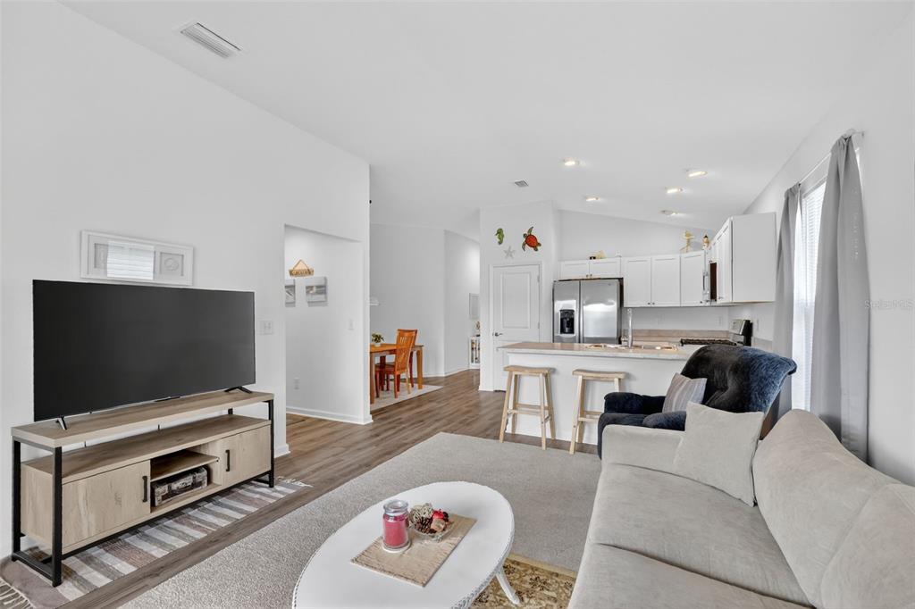 832 Conroe Street The Villages, FL 34762 - Photo 11 of 37 a living room with furniture and a flat screen tv