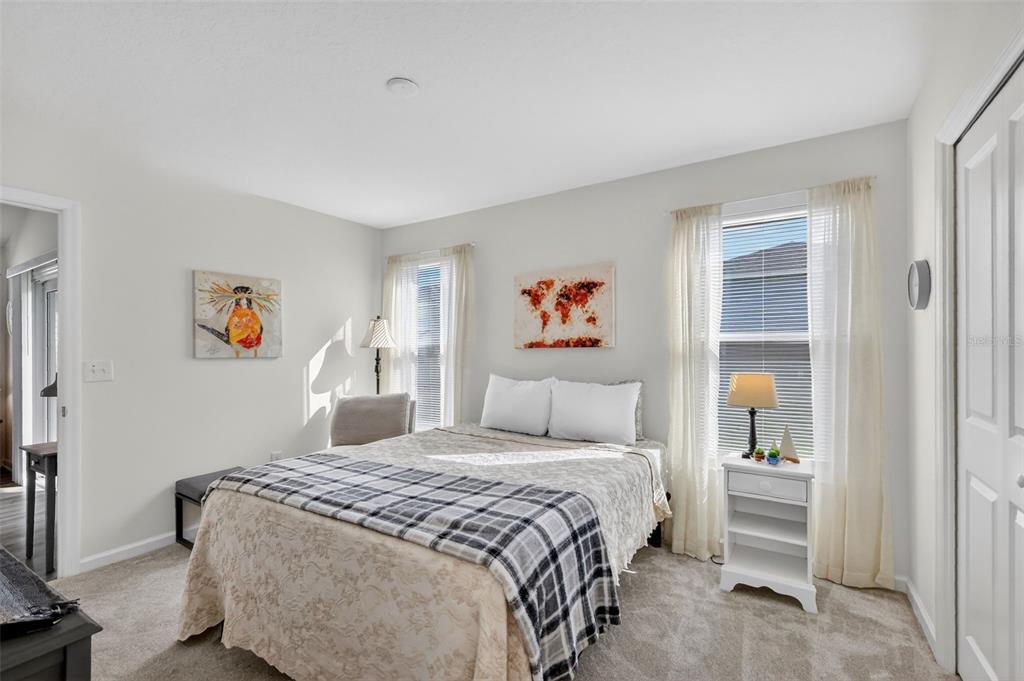 832 Conroe Street The Villages, FL 34762 - Photo 17 of 37 a bedroom with a bed and a window