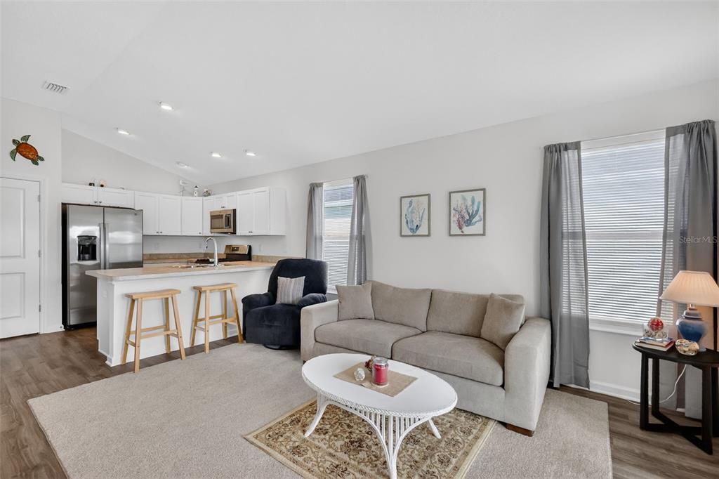 832 Conroe Street The Villages, FL 34762 - Photo 9 of 37 a living room with furniture kitchen and a dining table
