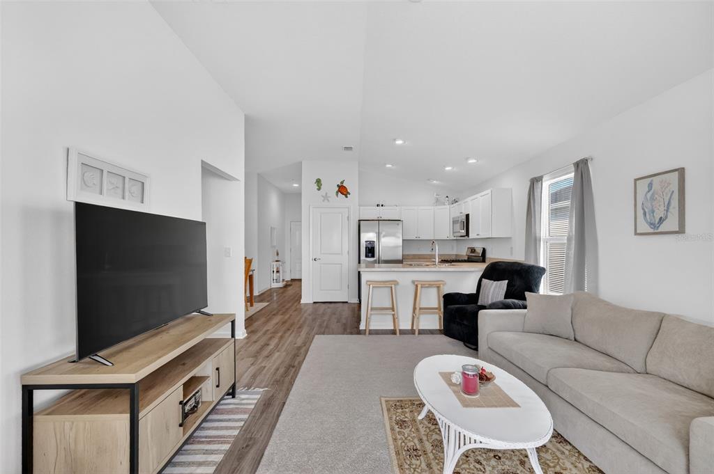 832 Conroe Street The Villages, FL 34762 - Photo 10 of 37 a living room with furniture and a flat screen tv