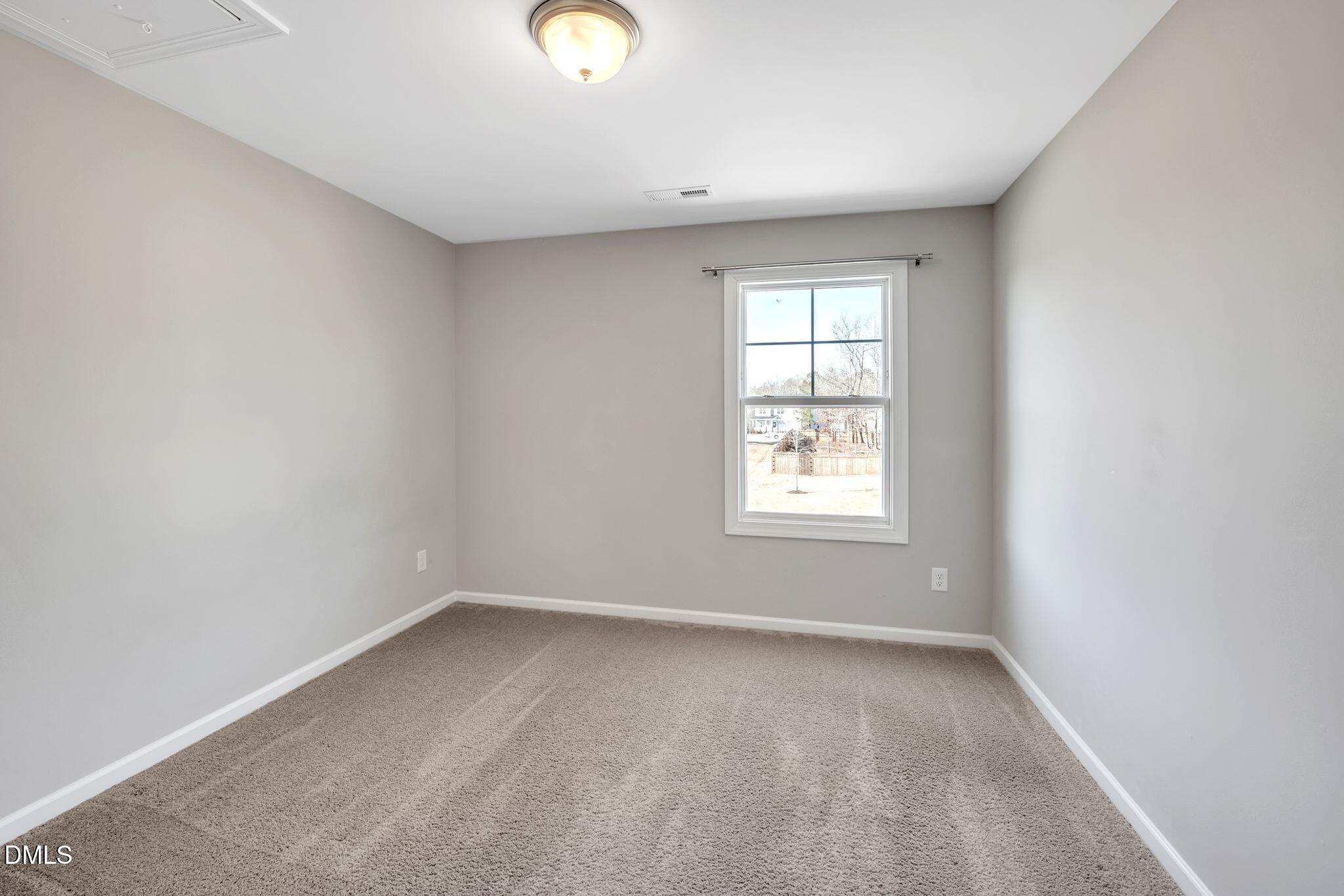 1505 Tawny View Lane Raleigh, NC 27603 - Photo 13 of 15 an empty room with a window