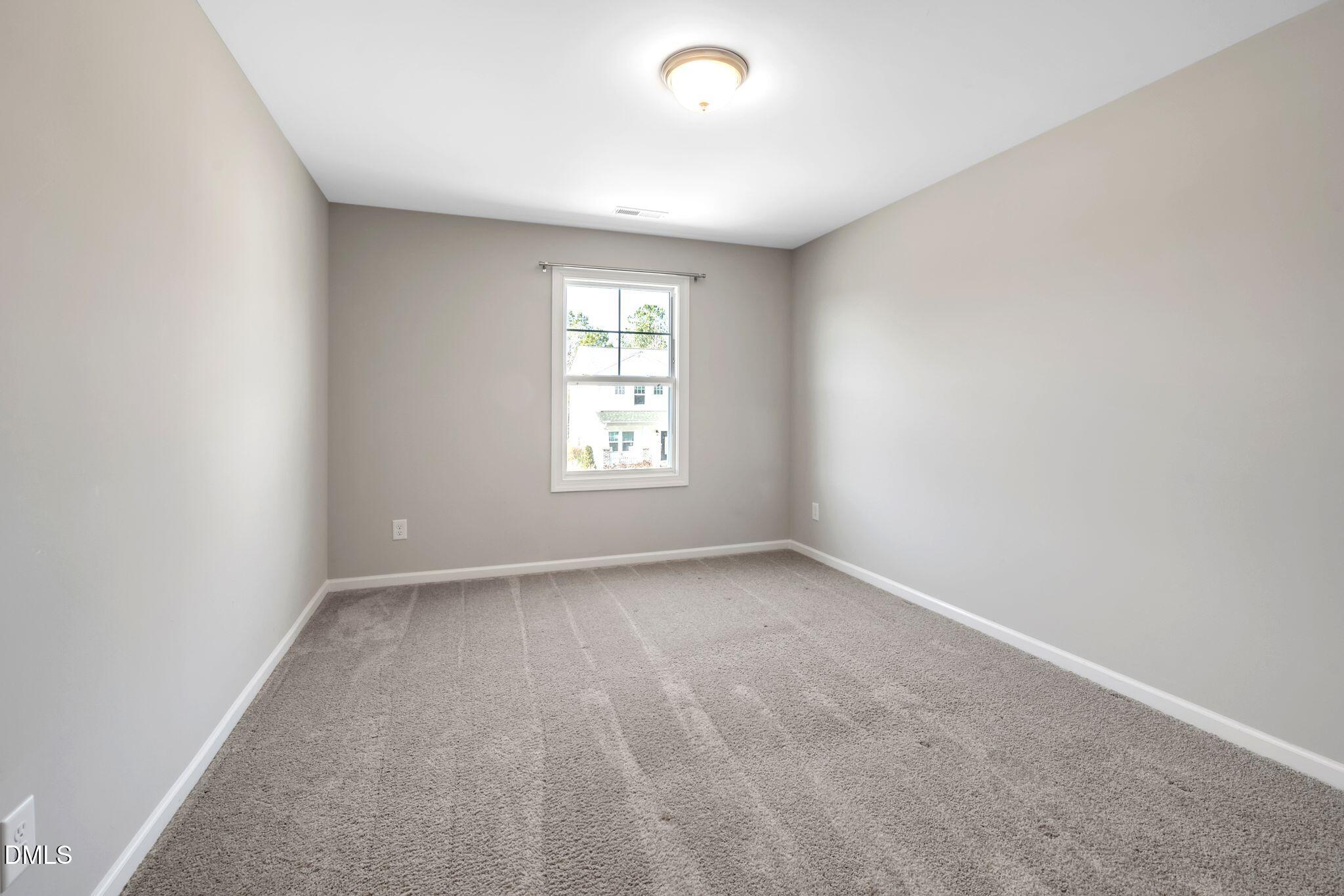 1505 Tawny View Lane Raleigh, NC 27603 - Photo 14 of 15 an empty room with a window