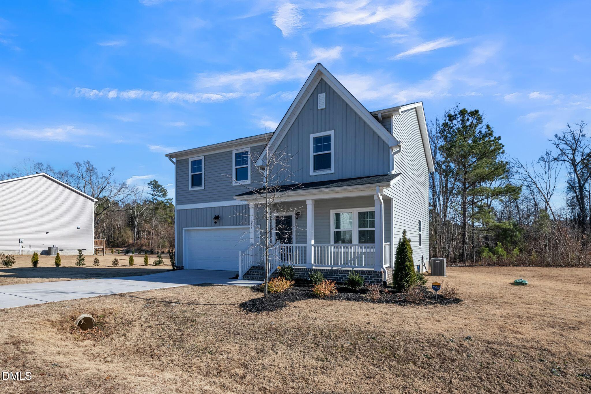 1505 Tawny View Lane Raleigh, NC 27603 - Photo 2 of 15 a front view of a house with a yard