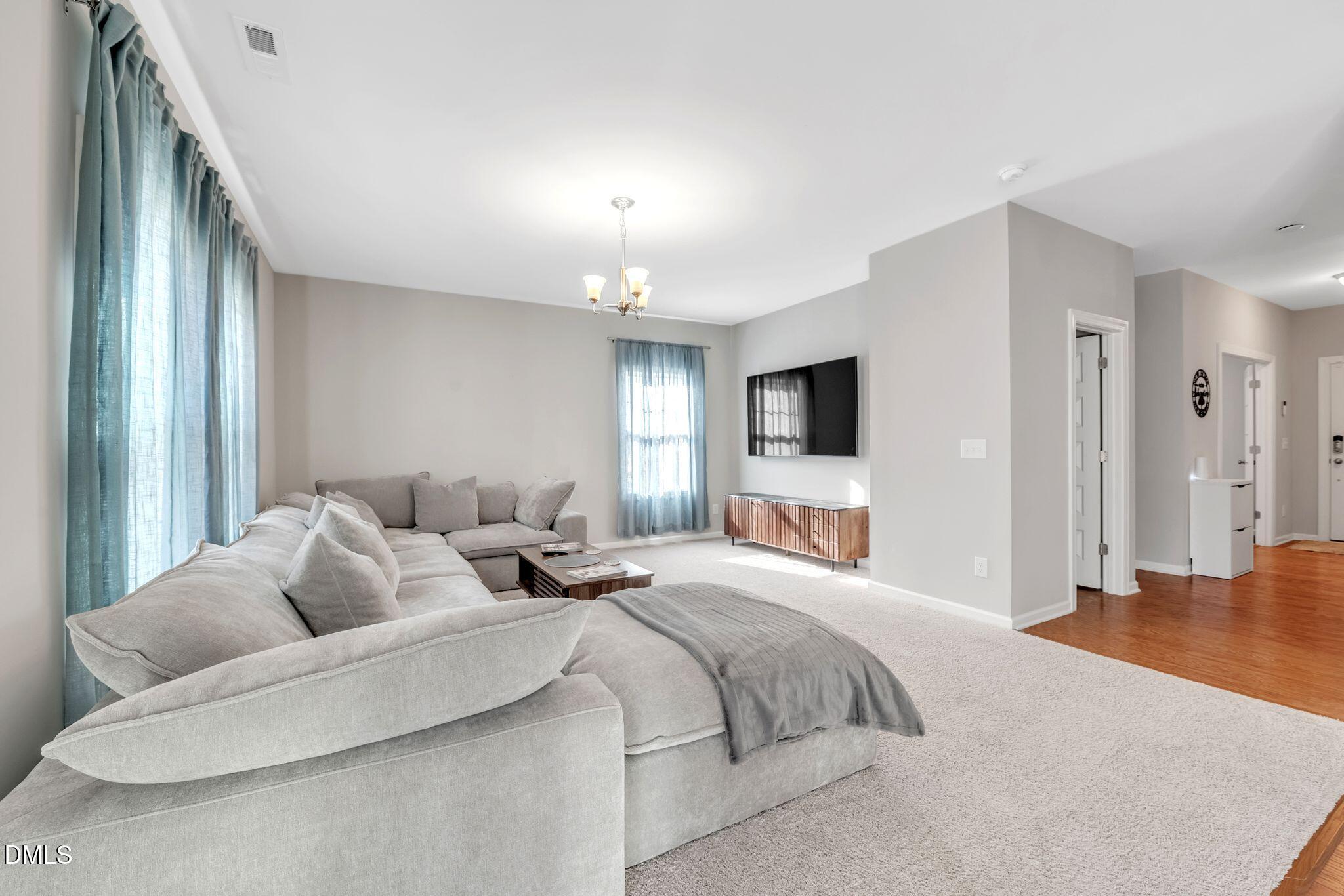1505 Tawny View Lane Raleigh, NC 27603 - Photo 6 of 15 a spacious bedroom with a bed and a flat screen tv