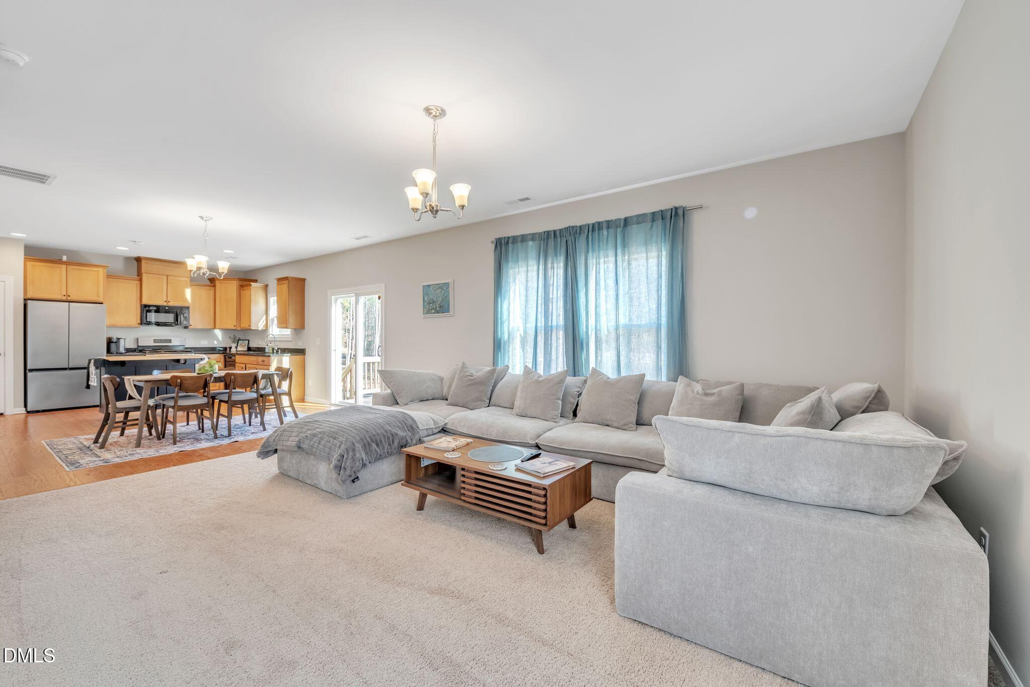 1505 Tawny View Lane Raleigh, NC 27603 - Photo 7 of 15 a living room with furniture and a table