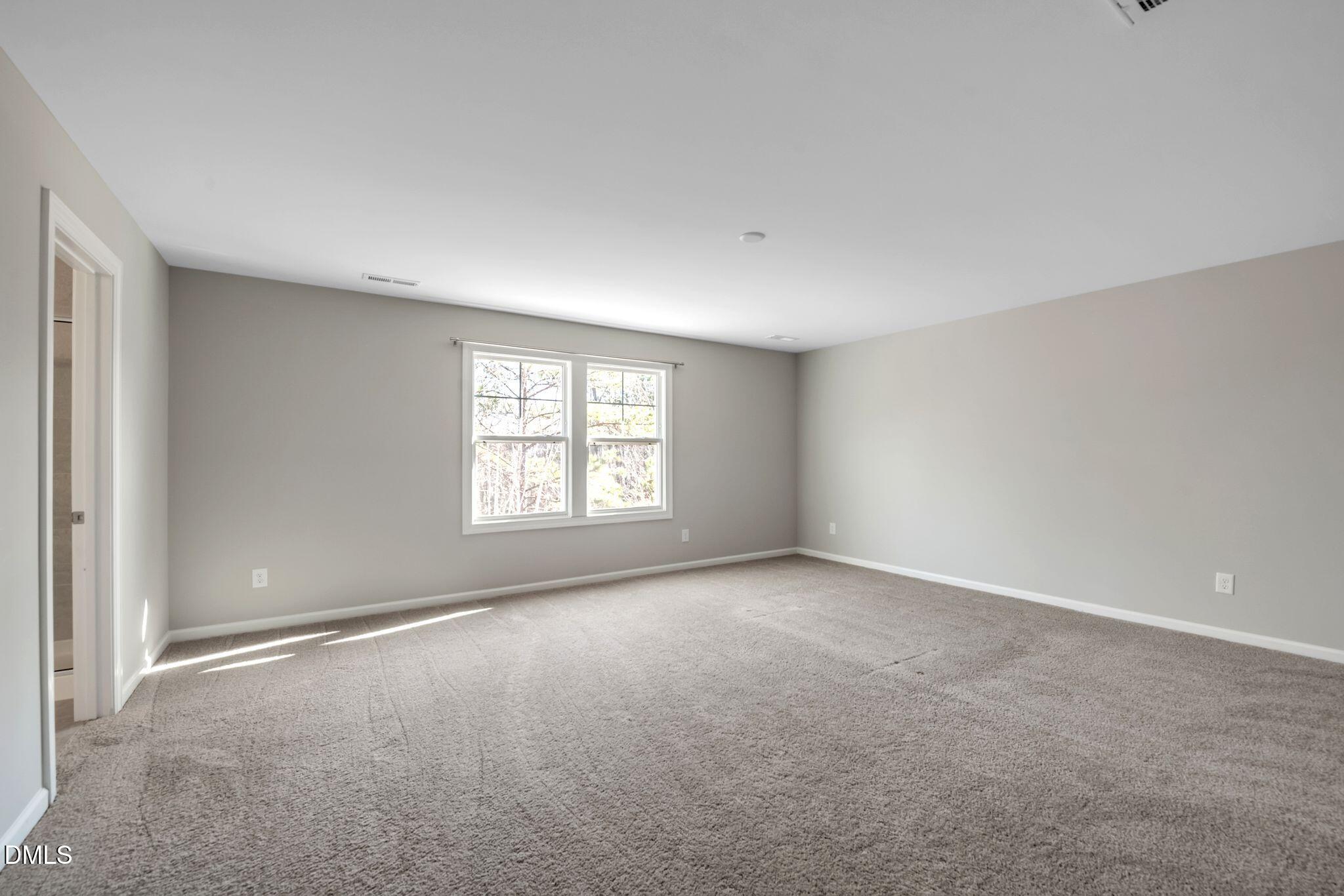 1505 Tawny View Lane Raleigh, NC 27603 - Photo 8 of 15 an empty room with windows