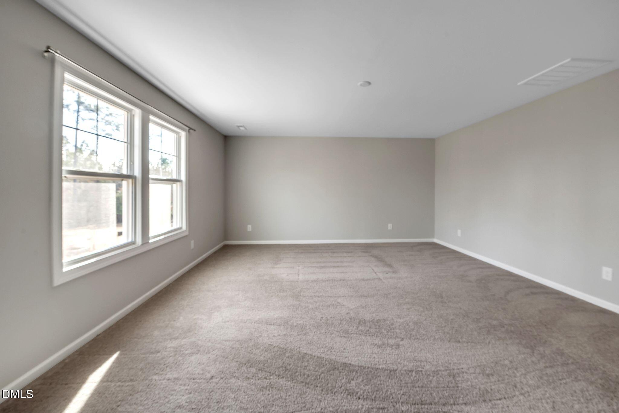 1505 Tawny View Lane Raleigh, NC 27603 - Photo 9 of 15 an empty room with a window