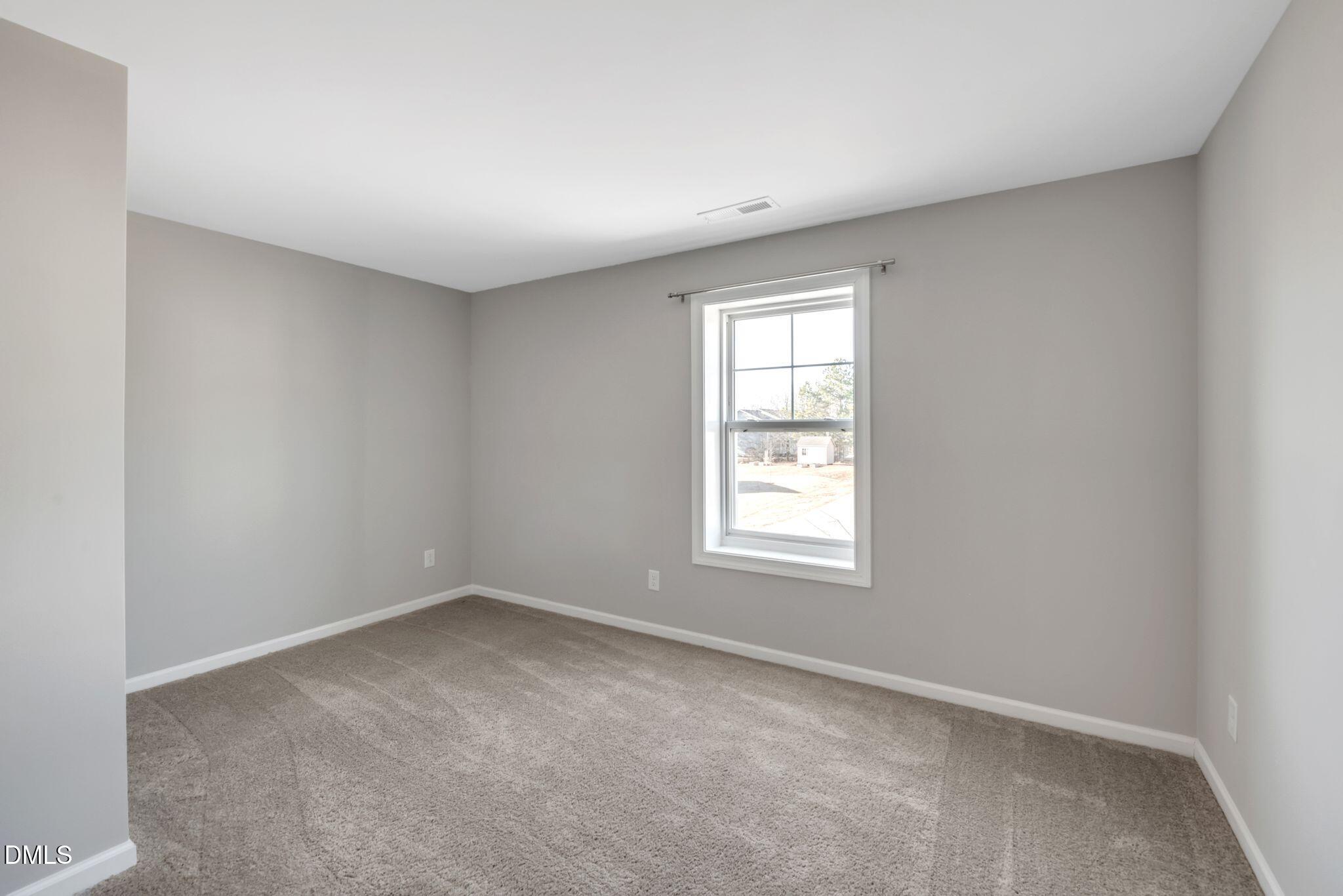 1505 Tawny View Lane Raleigh, NC 27603 - Photo 10 of 15 an empty room with a window