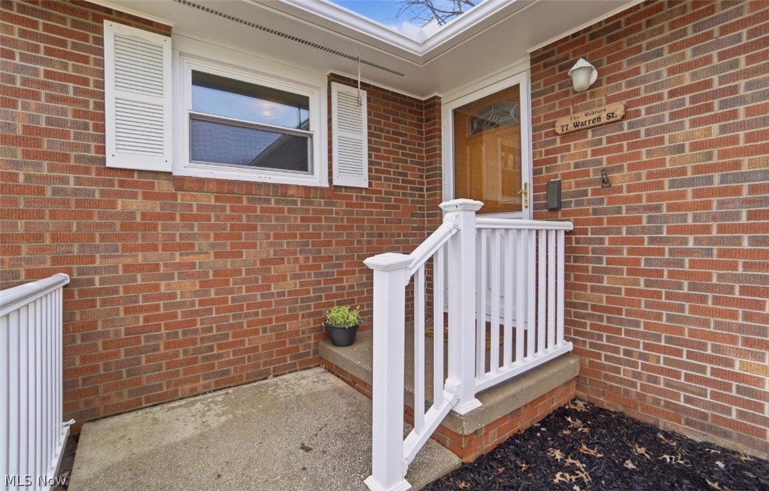 77 Warren Street Rittman, OH 44270 - Photo 5 of 41 Front of home, vinyl rail,concrete front porch
