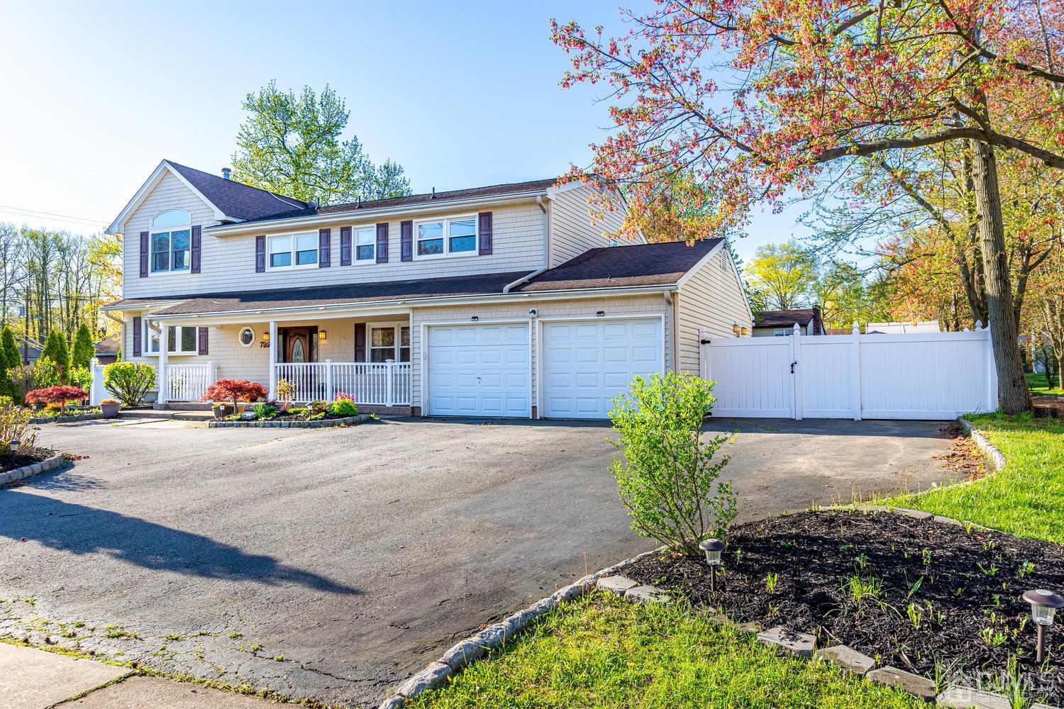 799 New Dover Road Edison, NJ 08820 - Photo 2 of 54 a front view of a house with garden