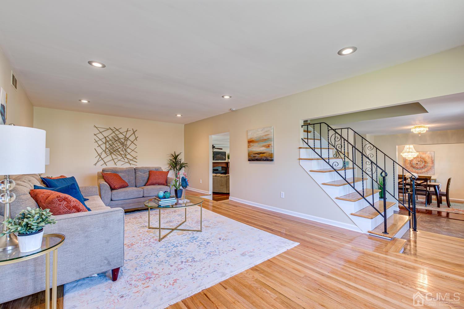799 New Dover Road Edison, NJ 08820 - Photo 11 of 54 a living room with furniture and wooden floor
