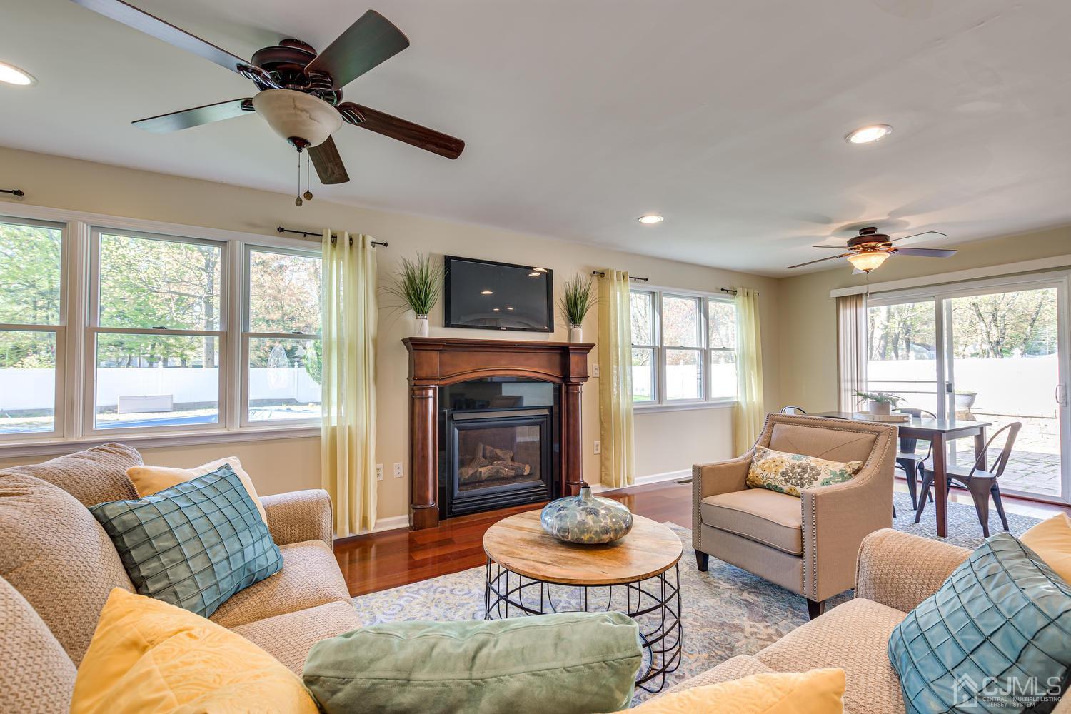 799 New Dover Road Edison, NJ 08820 - Photo 18 of 54 a living room with furniture and a fireplace