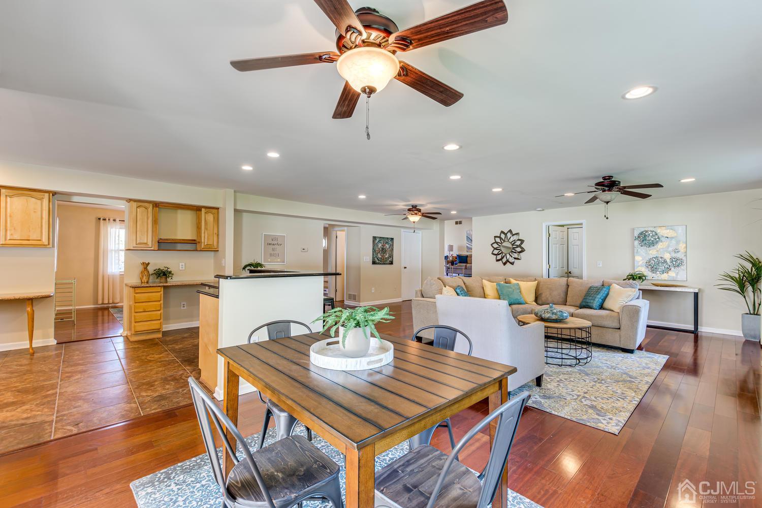 799 New Dover Road Edison, NJ 08820 - Photo 20 of 54 a view of a dining room with furniture and wooden floor