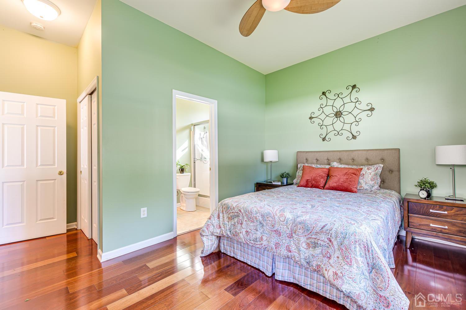 799 New Dover Road Edison, NJ 08820 - Photo 29 of 54 a bedroom with a bed and wooden floor