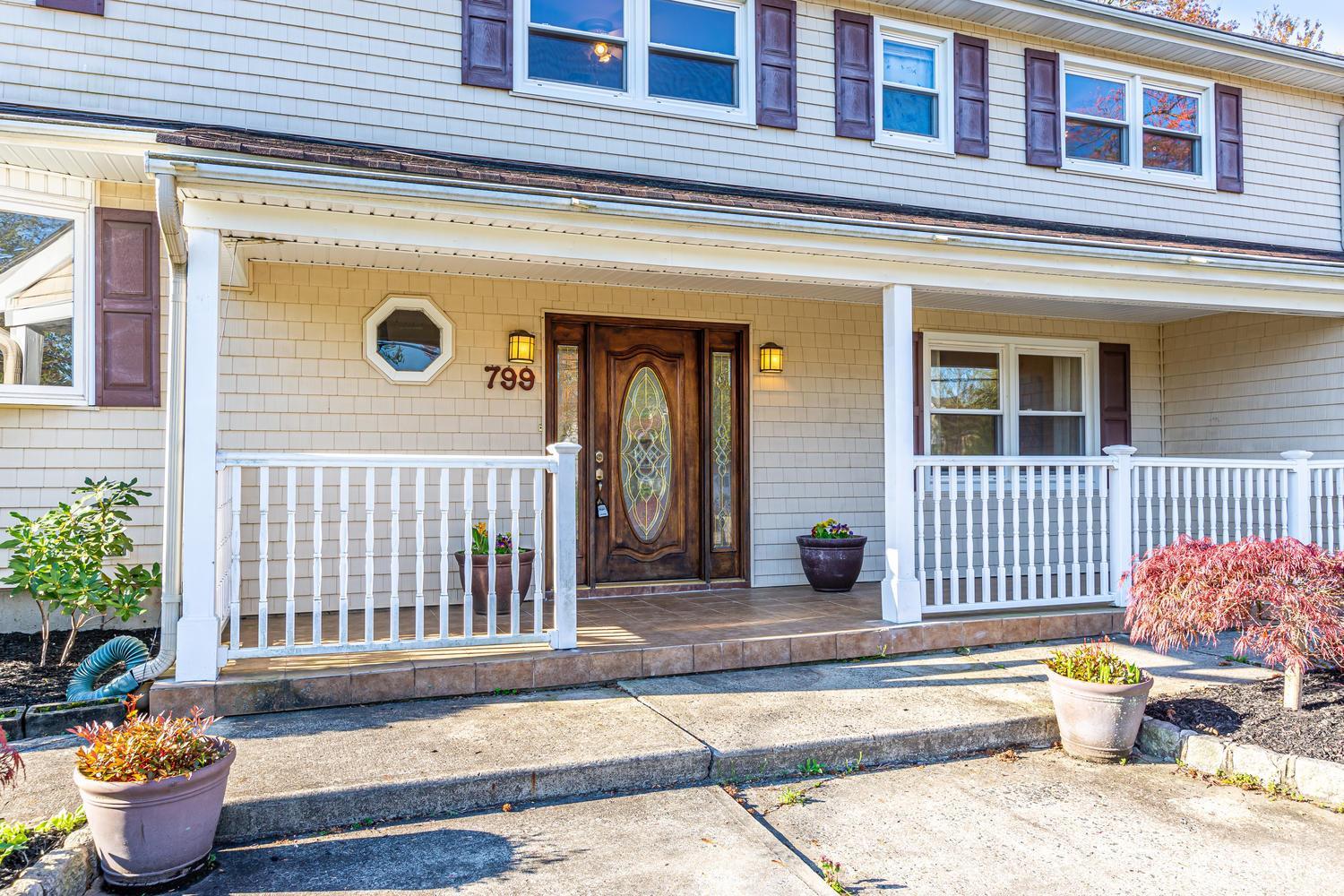 799 New Dover Road Edison, NJ 08820 - Photo 4 of 54 a front view of a house with outdoor seating