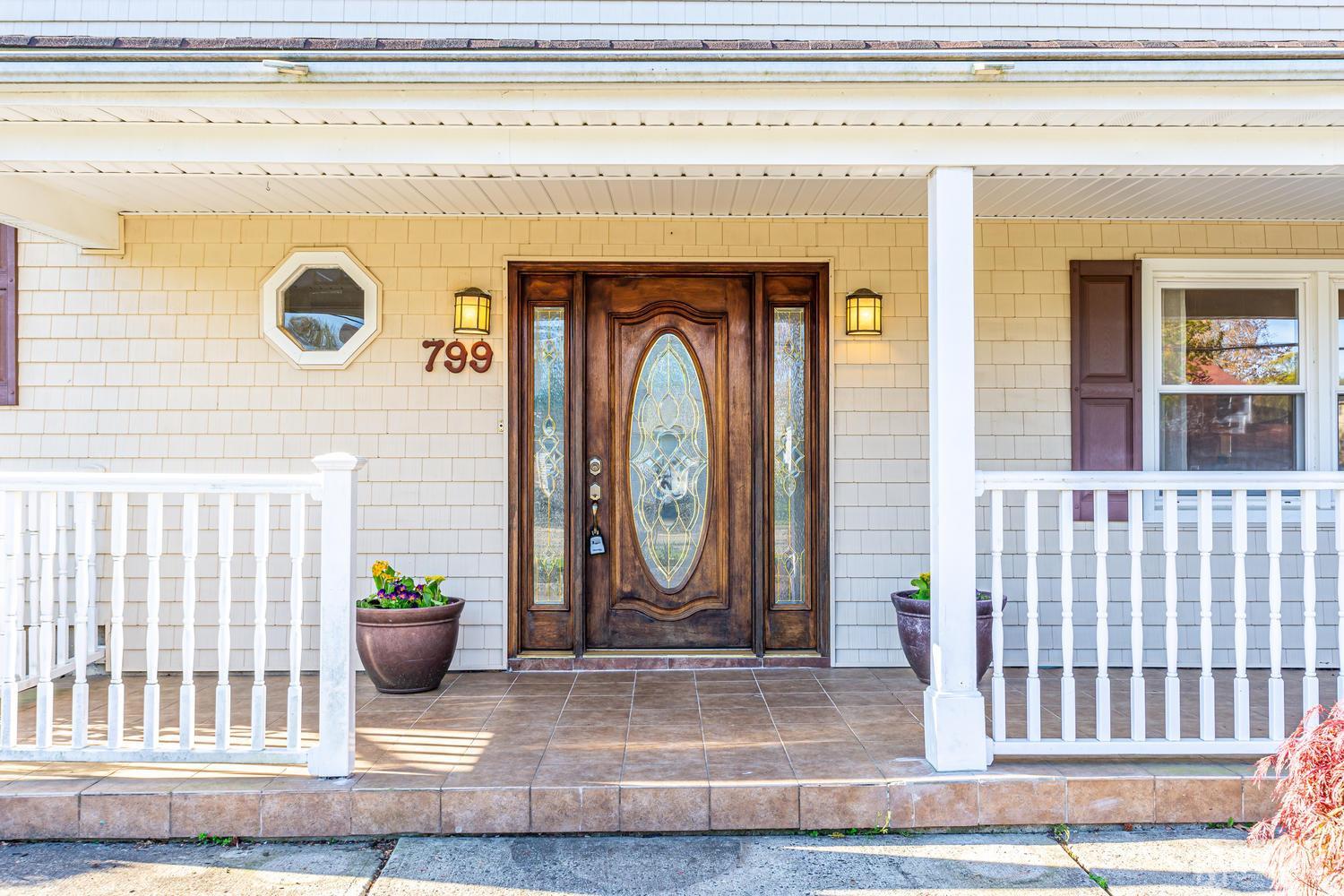 799 New Dover Road Edison, NJ 08820 - Photo 5 of 54 a view of a door with a potted plant