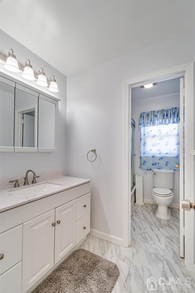 799 New Dover Road Edison, NJ 08820 - Photo 42 of 54 a bathroom with a sink toilet and shower