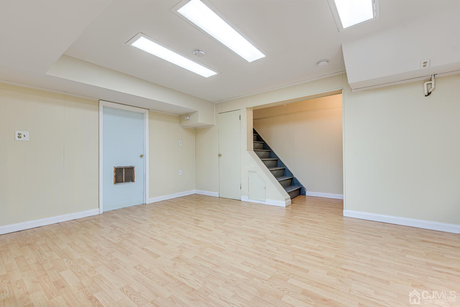 799 New Dover Road Edison, NJ 08820 - Photo 45 of 54 a view of an empty room with wooden floor