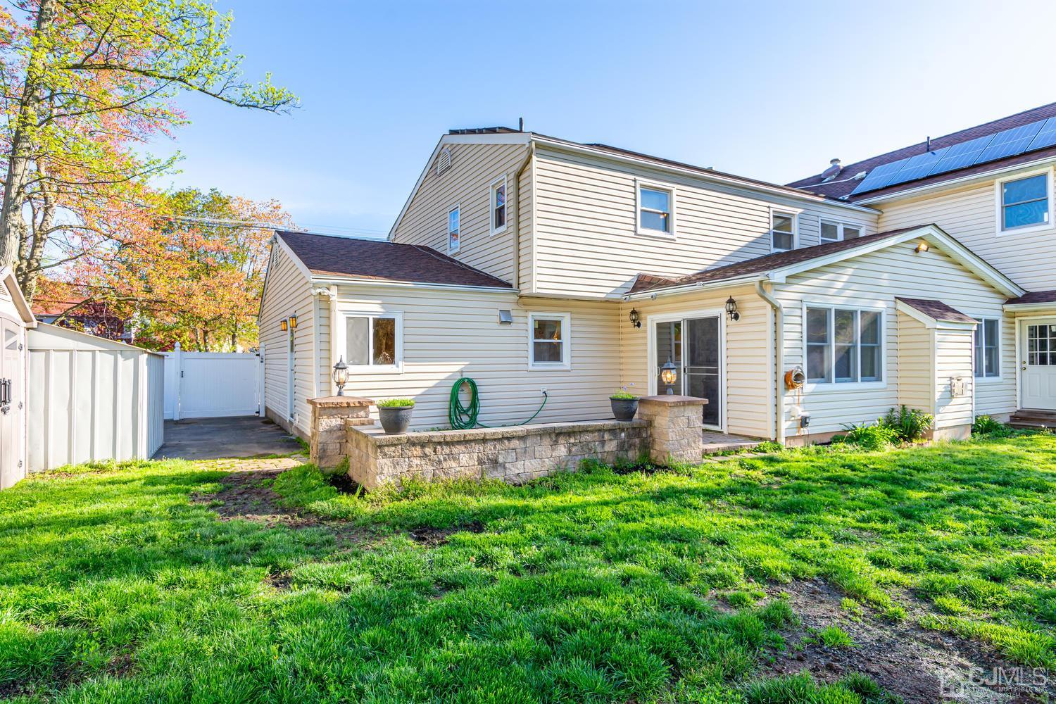 799 New Dover Road Edison, NJ 08820 - Photo 47 of 54 a front view of house with backyard and garden