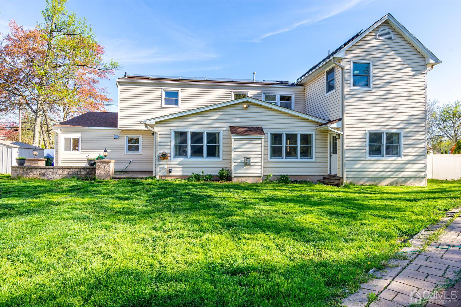 799 New Dover Road Edison, NJ 08820 - Photo 48 of 54 a front view of house with yard and green space
