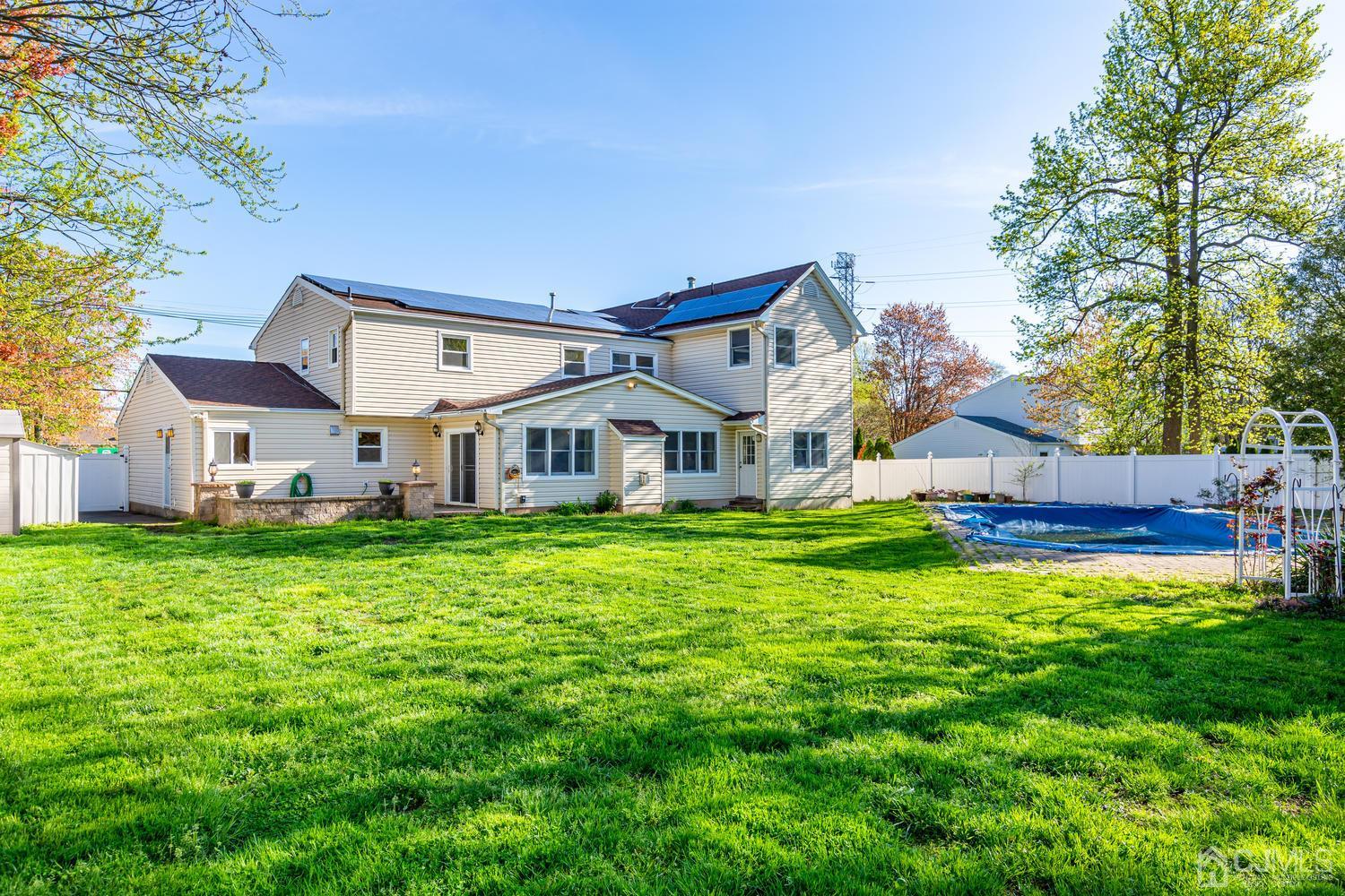 799 New Dover Road Edison, NJ 08820 - Photo 49 of 54 a view of a house with backyard and garden
