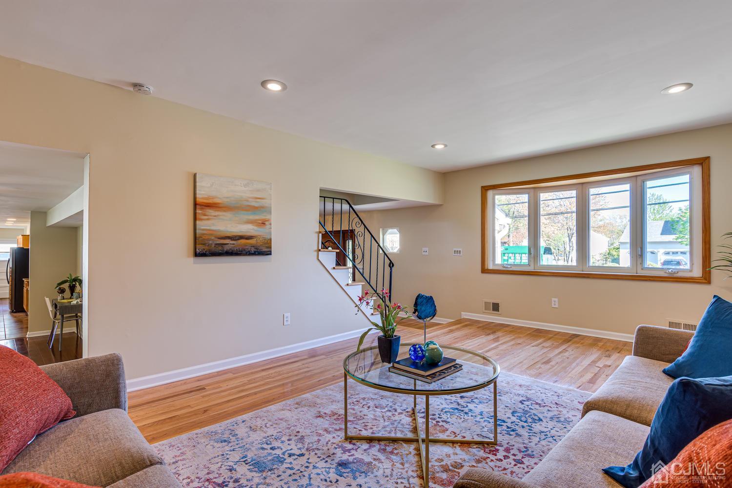 799 New Dover Road Edison, NJ 08820 - Photo 10 of 54 a living room with furniture and a wooden floor