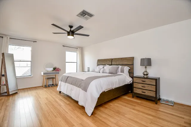 a bed room with a bed and a window