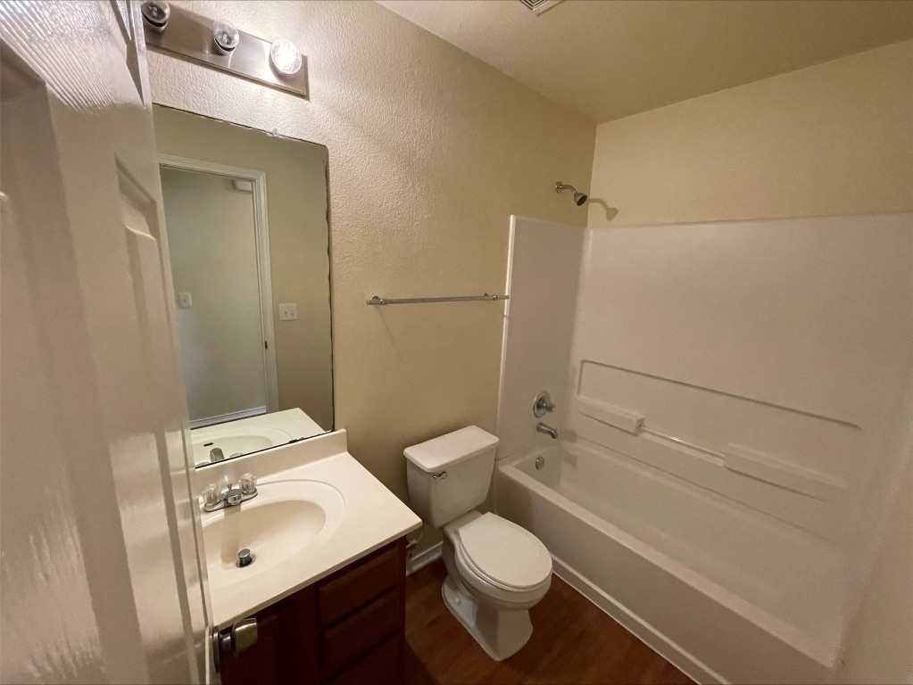 6912 Quinton Drive Austin, TX 78747 - Photo 24 of 24 a bathroom with a sink toilet and shower
