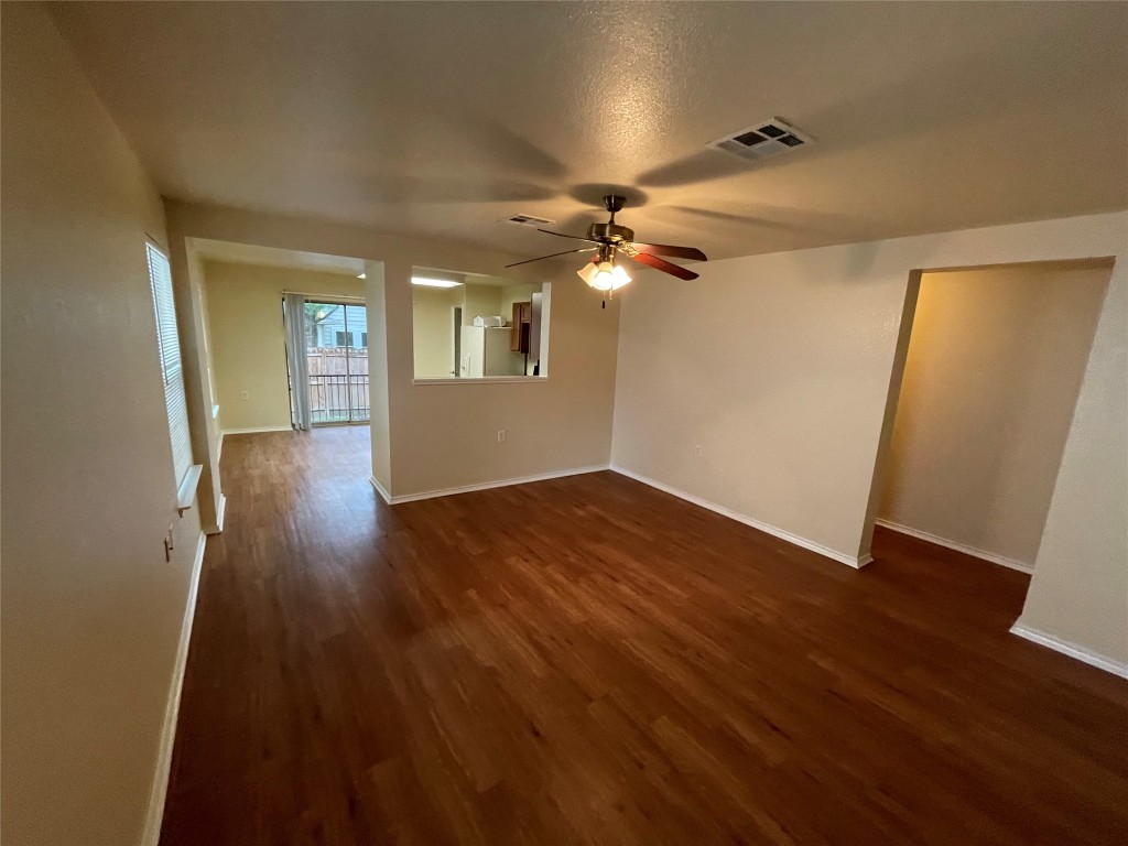 6912 Quinton Drive Austin, TX 78747 - Photo 6 of 24 wooden floor in an empty room with a window