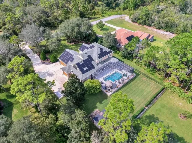 an aerial view of a house with a garden