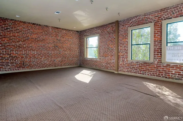 a view of a car park in front of a building