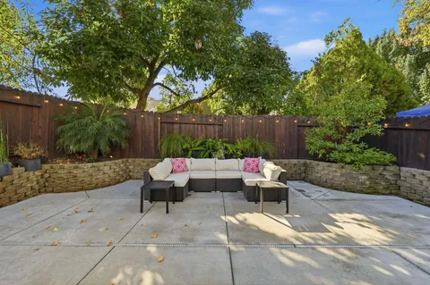 a outdoor living space with furniture and flowers