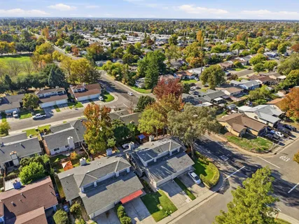 an aerial view of residential houses with outdoor space
