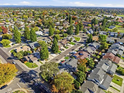 an aerial view of residential houses with outdoor space