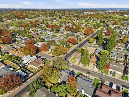 an aerial view of residential houses with outdoor space