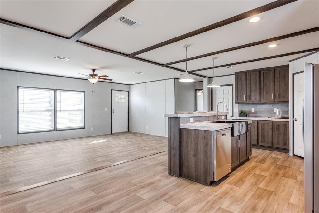 175 Cedar Drive Azle, TX 76020 - Photo 8 of 25 a large kitchen with stainless steel appliances granite countertop a stove and a sink