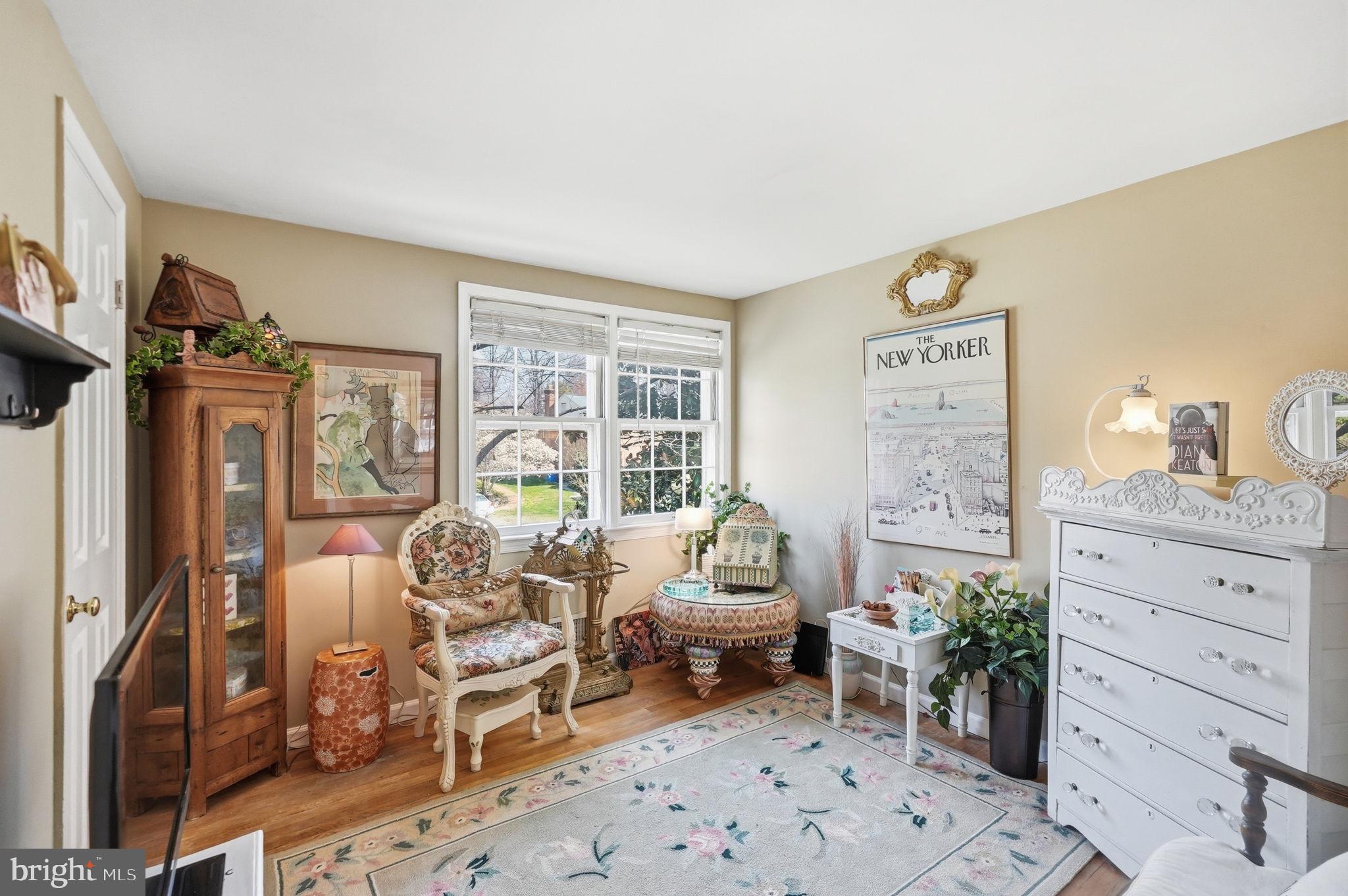 8406 Geneva Mason Road Potomac, MD 20854 - Photo 22 of 34 a living room with furniture and a large window