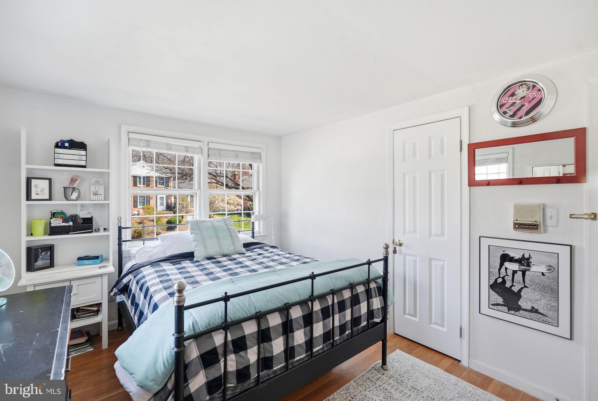 8406 Geneva Mason Road Potomac, MD 20854 - Photo 25 of 34 a bedroom with a bed and a window