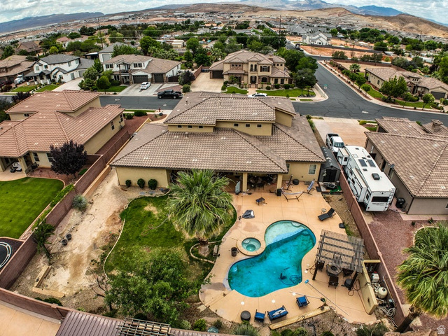 3683 South 2640 West St. George, UT 84790 - Photo 19 of 41 Terracotta-tiled roof residence with a kidney-shaped pool and integrated spa