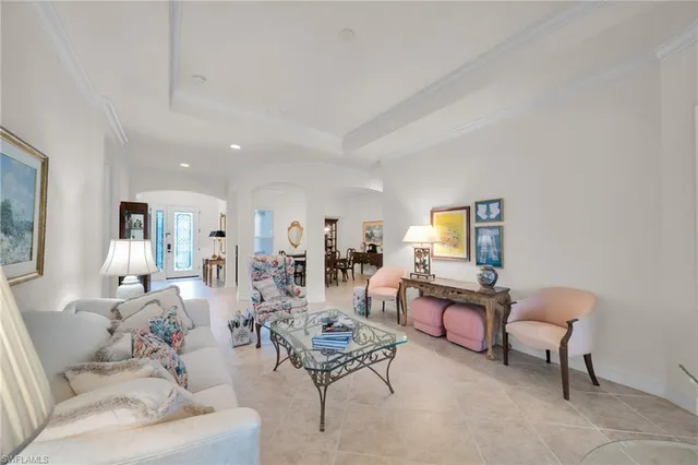 a spacious bedroom with a bed and a couch