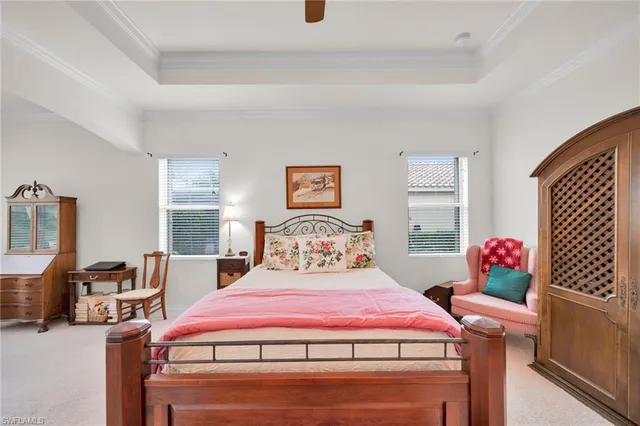a bathroom with a granite countertop tub a double vanity sink and a mirror