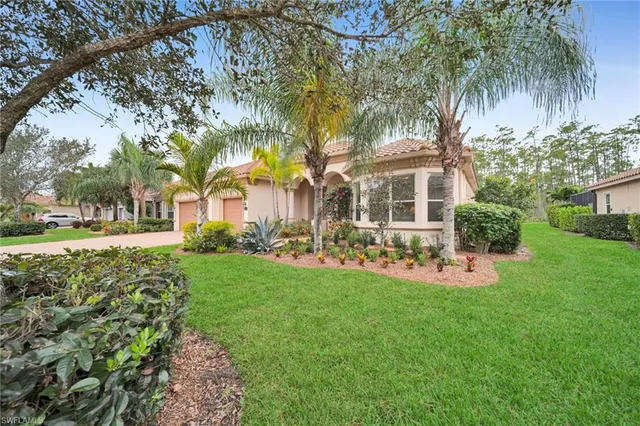 a front view of a house with swimming pool having outdoor seating
