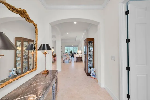 a living room with lots of furniture and a chandelier